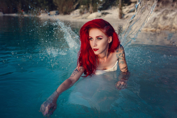 Cosplay on a mermaid Ariel, woman with red hair - Fotografie, Obrázek