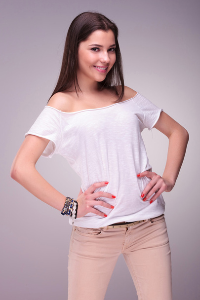 casual young woman with hands on hips - Photo, Image