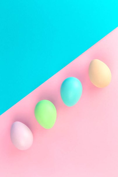 Colorful pastel easter eggs on pink and blue - Foto, immagini