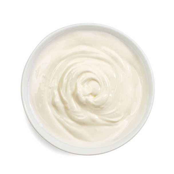 Sour cream in bowl, mayonnaise, yogurt, isolated on white background. Top view. - Fotoğraf, Görsel