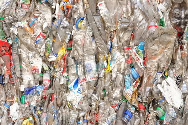 Plastic Bottles in Extruded Form at a Plant for Processing Raw Materials. - Photo, Image