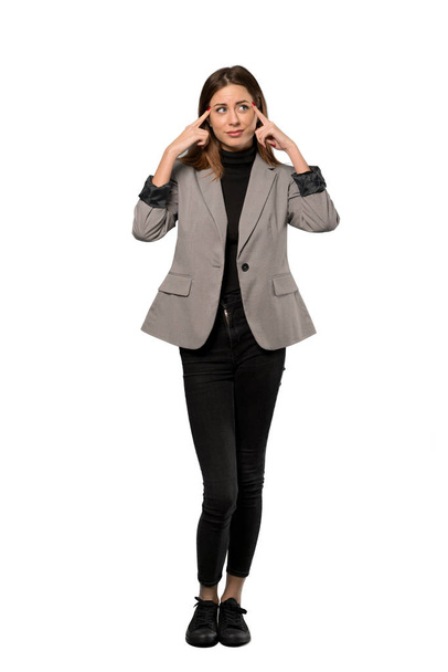 A full-length shot of a Business woman having doubts and thinking over isolated white background - Foto, afbeelding