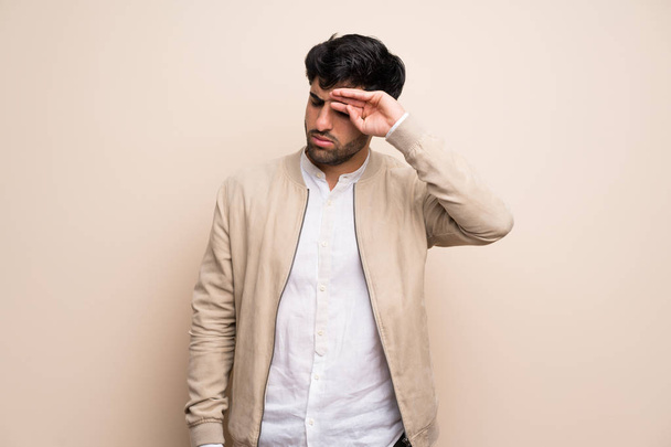 Young man over isolated wall with tired and sick expression - Photo, Image