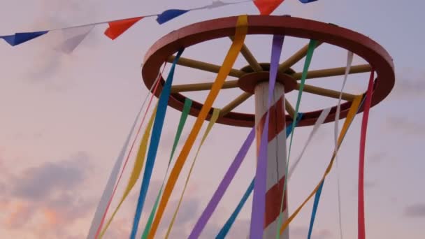 Decorative multicolor ribbons on wooden wheel construction - Footage, Video