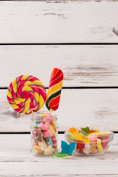 Delicious candies on wooden background. - Photo, Image
