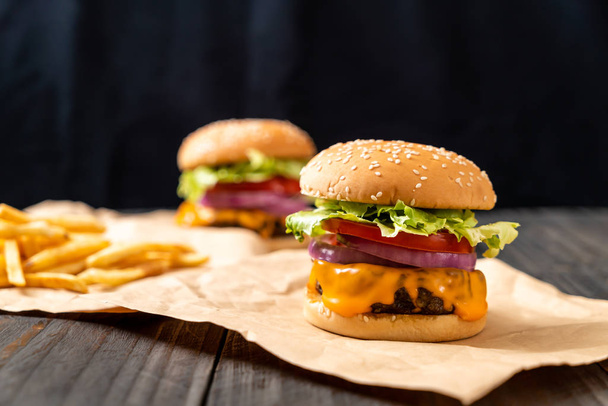 fresh tasty beef burger with cheese and french fries - Foto, imagen