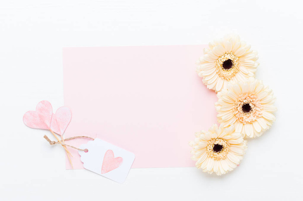 Spring greeting card, pastel color gerbera flowers on the white  - Fotó, kép