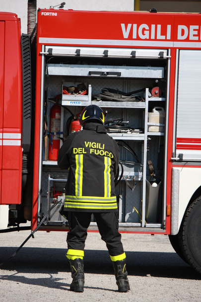 Firefighters prepare for the tools from the truck during a serio - Photo, Image