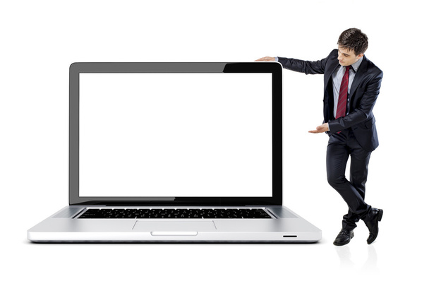 attractive young business man with laptop on white background - Zdjęcie, obraz
