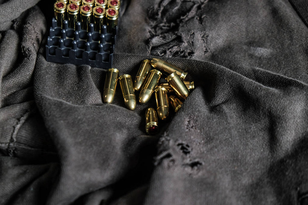 FMJ 9mm automatic pistol ballistic on cloth background - Photo, Image