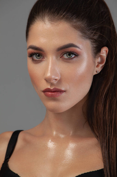 Closeup portrait of beautiful young woman with clean and fresh skin. Nude makeup. Concept for cosmetology ads with copy space, beauty magazine and spa. - Φωτογραφία, εικόνα