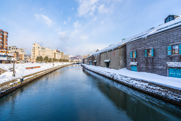 Beautiful landscape and cityscape of Otaru canal river in winter - Photo, Image