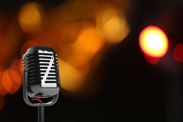 Retro style microphone against blurred background, space for text - Photo, Image