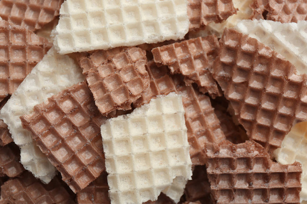 Tasty crumbled wafers as background, top view. Crispy food - 写真・画像