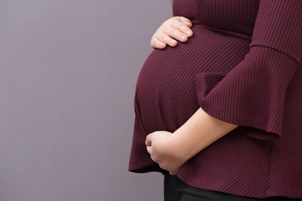 Expectant Mom Holding Her Budding Baby Bump - Photo, Image
