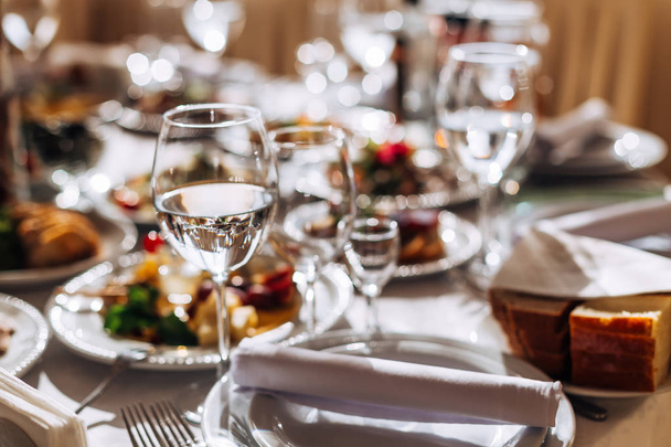Wedding table setting. Table with food and drink. cutlery and wi - Photo, Image