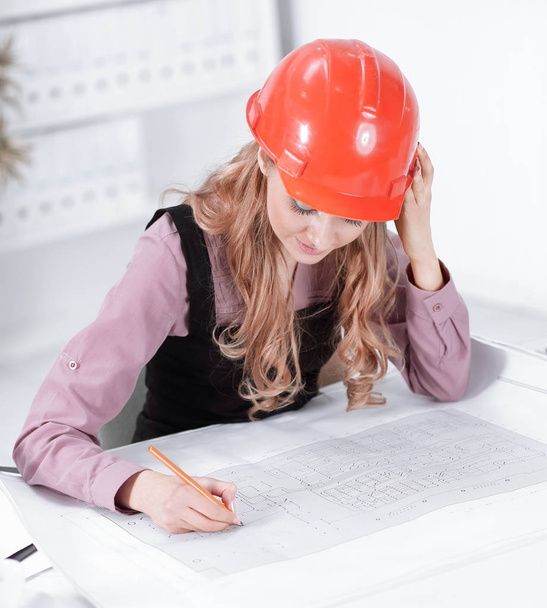 Business woman Drawing Blueprint At Office Desk - Photo, image