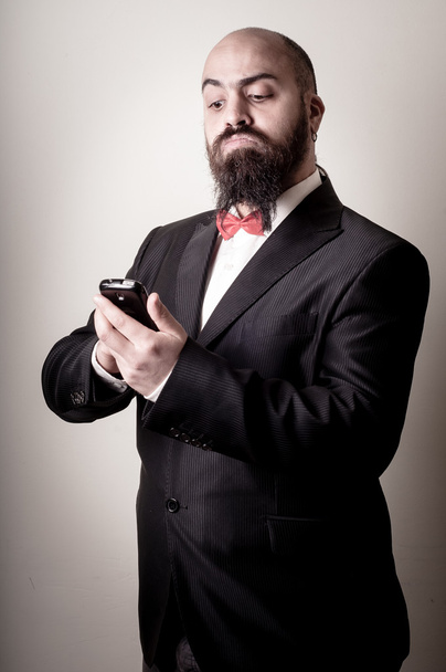 funny elegant bearded man on the phone - 写真・画像