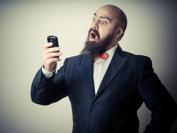 funny elegant bearded man on the phone - Фото, изображение