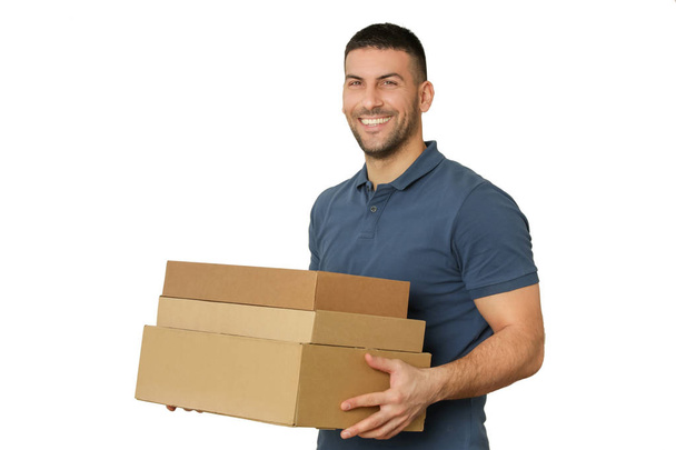 Young man holding cardboard boxes - Foto, Imagen