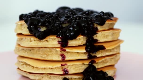 Breakfast of sweet pancakes with berry jam, black currant - Footage, Video