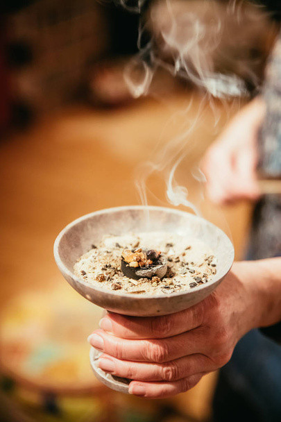 Traditional (esoteric) incense ritual at New Year and Christmas, - 写真・画像