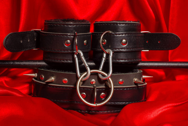 Close up bdsm outfit. Bondage, kinky adult sex games, kink and BDSM lifestyle concept. - Photo, Image