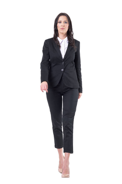 Displeased bossy business female ceo walking towards camera. Full body isolated on white background. - Foto, immagini