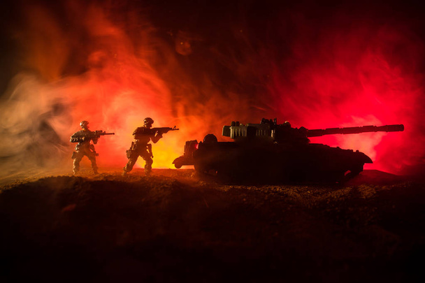 War Concept. Military silhouettes fighting scene on war fog sky background, Silhouette of armored vehicle below Cloudy Skyline At night. Attack scene. Tanks battle. Artwork decoration - Photo, Image