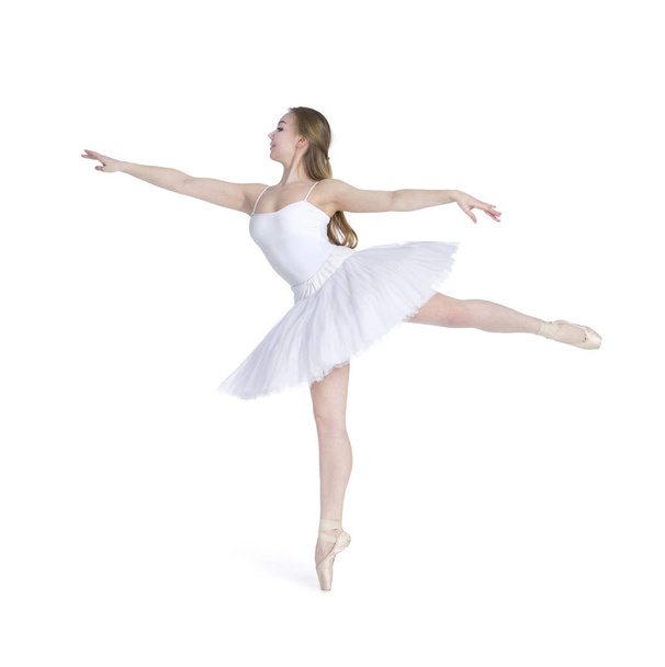 A girl with long hair, in a white tutu dancing ballet. - Foto, afbeelding