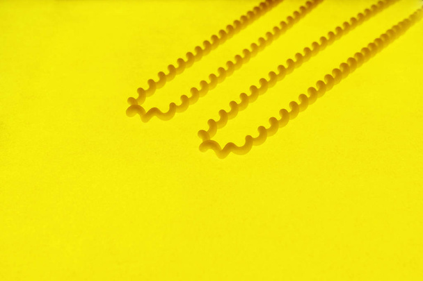 Pasta fusilli on a colored background - Photo, image