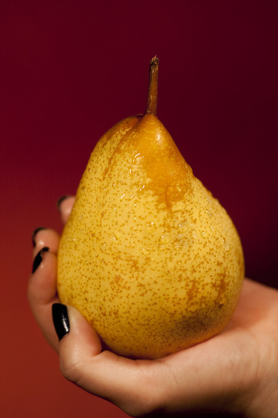 holding a pear - Photo, Image