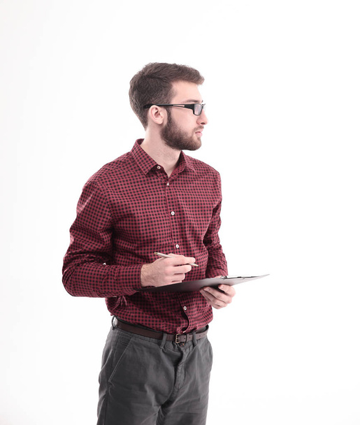 successful young designer with pen and clipboard.isolated on white. - 写真・画像