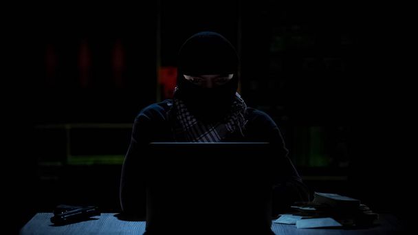Islamic terrorist getting instructions of attack via internet, financing online - Fotoğraf, Görsel