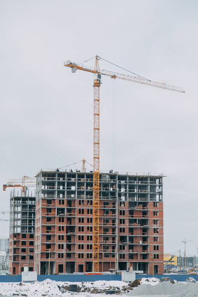 Construction of modern high-rise buildings. Cranes and machinery - Φωτογραφία, εικόνα