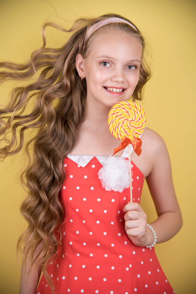 bright photo of a girl with candy - Φωτογραφία, εικόνα