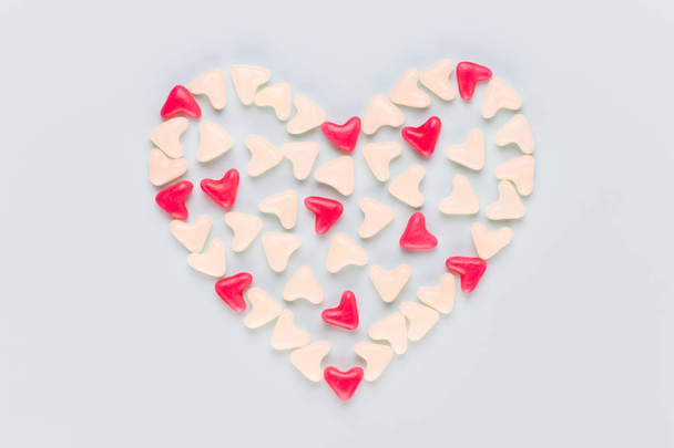 Valentines day background pastel hearts on blue wooden backgroun - Photo, image