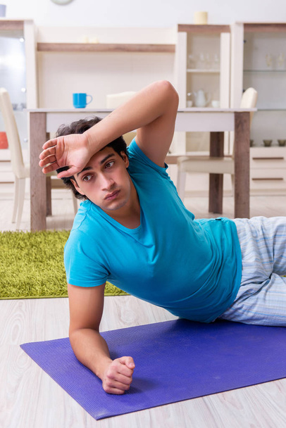 Young handsome man doing morning exercises  - Foto, Bild