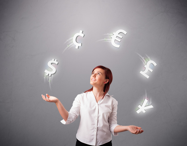 young lady standing and juggling with currency icons - Photo, Image