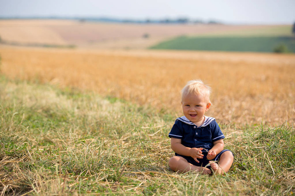 Baby boy in plain field in France - Foto, Imagen