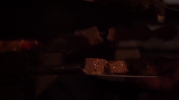 the meat from the plate is shifted to the grill. - Footage, Video