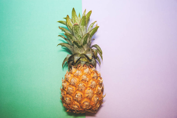 Pineapple on two color backgrounds, selective focus - Fotografie, Obrázek
