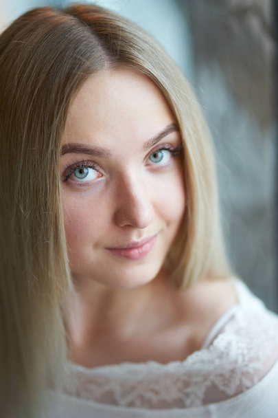 Portrait of young blonde smiling girl  - Foto, imagen