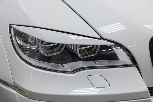 Headlight with lining view of luxury very expensive new white BM - Photo, Image