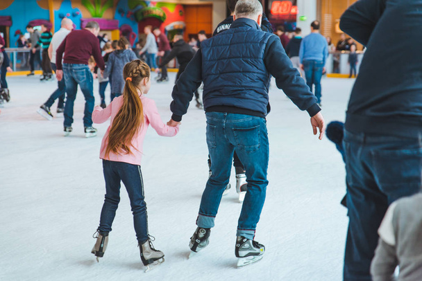 LVIV, UKRAINE - February 3, 2019: people skating on ski rink in city mall - Photo, Image