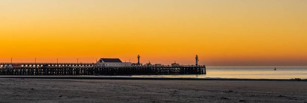 the beach harbor of Blankenberge, belgium, Sunset with colorful sky, architecture of the belgian coast - Photo, Image