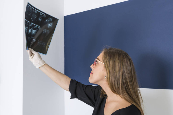female doctor looking at an x-ray - Photo, Image