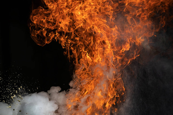 Closeup Fire flames from gas explosion on black background. - 写真・画像