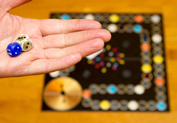 Board game. Hand with dice - Photo, Image
