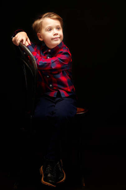 Little boy on a black background. - Fotografie, Obrázek